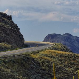 Preview wallpaper road, turn, rocks, hills