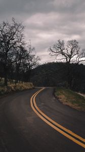 Preview wallpaper road, turn, stripes, trees, hills, nature