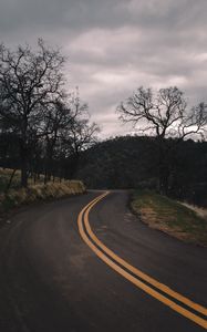 Preview wallpaper road, turn, stripes, trees, hills, nature