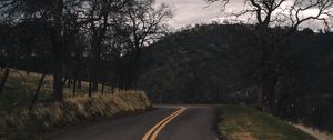 Preview wallpaper road, turn, stripes, trees, hills, nature