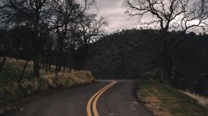 Preview wallpaper road, turn, stripes, trees, hills, nature