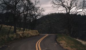 Preview wallpaper road, turn, stripes, trees, hills, nature