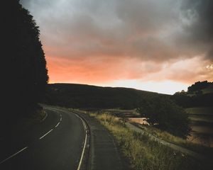 Preview wallpaper road, turn, sunset, trees, sky, clouds