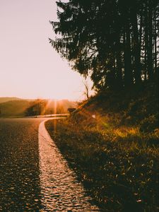 Preview wallpaper road, turn, sunset, sunlight, nature