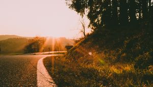 Preview wallpaper road, turn, sunset, sunlight, nature
