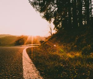 Preview wallpaper road, turn, sunset, sunlight, nature