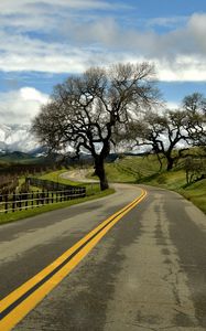 Preview wallpaper road, turn, tree, clouds