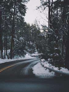 Preview wallpaper road, turn, trees, snow, asphalt