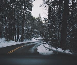 Preview wallpaper road, turn, trees, snow, asphalt