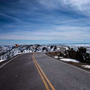 Preview wallpaper road, turn, winding, asphalt, horizon, snowy