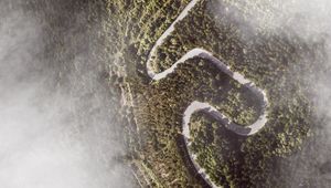 Preview wallpaper road, winding, aerial view, mountains, forest, clouds