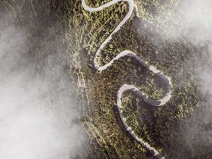 Preview wallpaper road, winding, aerial view, mountains, forest, clouds