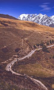 Preview wallpaper road, winding, mountains, snowy, slope