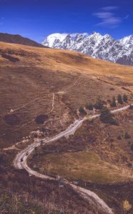 Preview wallpaper road, winding, mountains, snowy, slope