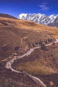 Preview wallpaper road, winding, mountains, snowy, slope