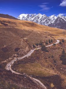 Preview wallpaper road, winding, mountains, snowy, slope