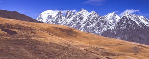 Preview wallpaper road, winding, mountains, snowy, slope