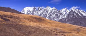 Preview wallpaper road, winding, mountains, snowy, slope