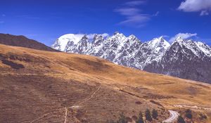 Preview wallpaper road, winding, mountains, snowy, slope