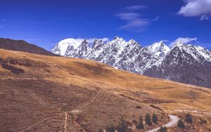 Preview wallpaper road, winding, mountains, snowy, slope