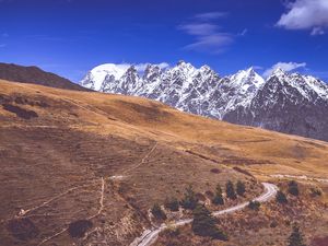 Preview wallpaper road, winding, mountains, snowy, slope