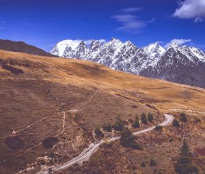 Preview wallpaper road, winding, mountains, snowy, slope