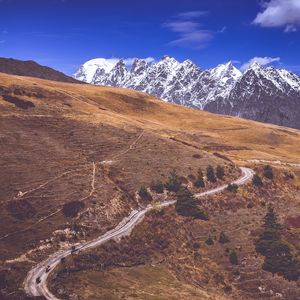 Preview wallpaper road, winding, mountains, snowy, slope