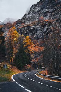 Preview wallpaper road, winding, rocks, marking, fog