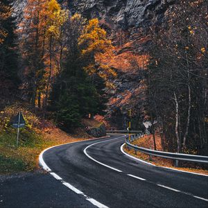 Preview wallpaper road, winding, rocks, marking, fog