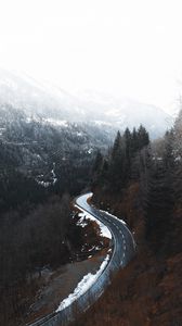 Preview wallpaper road, winding, trees, mountains, snowy