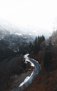 Preview wallpaper road, winding, trees, mountains, snowy
