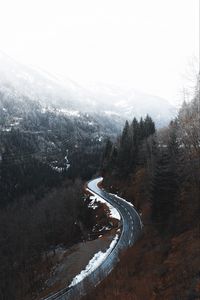 Preview wallpaper road, winding, trees, mountains, snowy