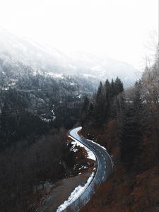 Preview wallpaper road, winding, trees, mountains, snowy