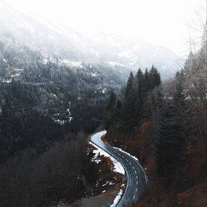 Preview wallpaper road, winding, trees, mountains, snowy