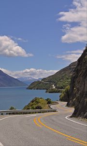 Preview wallpaper road, zigzag, rocks, sea, landscape