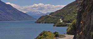 Preview wallpaper road, zigzag, rocks, sea, landscape