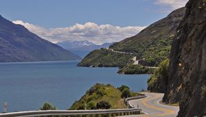 Preview wallpaper road, zigzag, rocks, sea, landscape