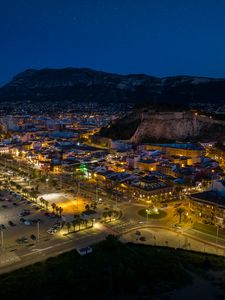 Preview wallpaper roads, buildings, lights, streets, city, aerial view