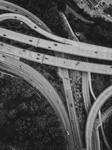 Preview wallpaper roads, cars, trees, black and white, aerial view