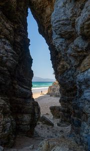 Preview wallpaper rock, arch, beach, man, sea, nature