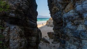 Preview wallpaper rock, arch, beach, man, sea, nature