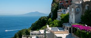Preview wallpaper rock, buildings, houses, sea, mountain