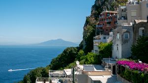 Preview wallpaper rock, buildings, houses, sea, mountain