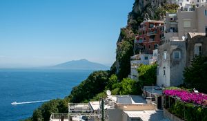 Preview wallpaper rock, buildings, houses, sea, mountain