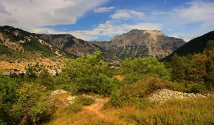 Preview wallpaper rock, bushes, grass, peak, sky