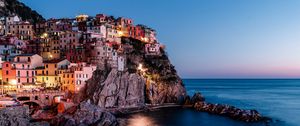 Preview wallpaper rock, city, sea, sunset, italy