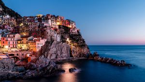 Preview wallpaper rock, city, sea, sunset, italy