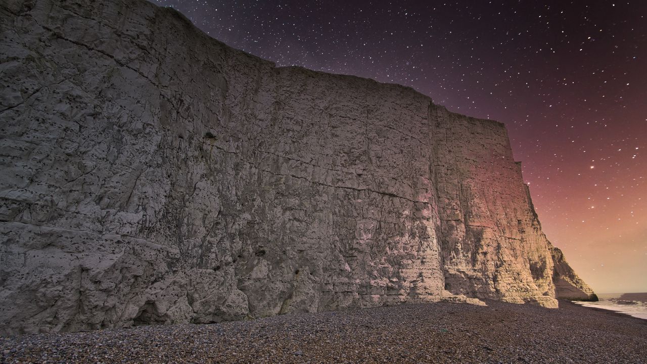 Wallpaper rock, cliff, coast, starry sky, pebble