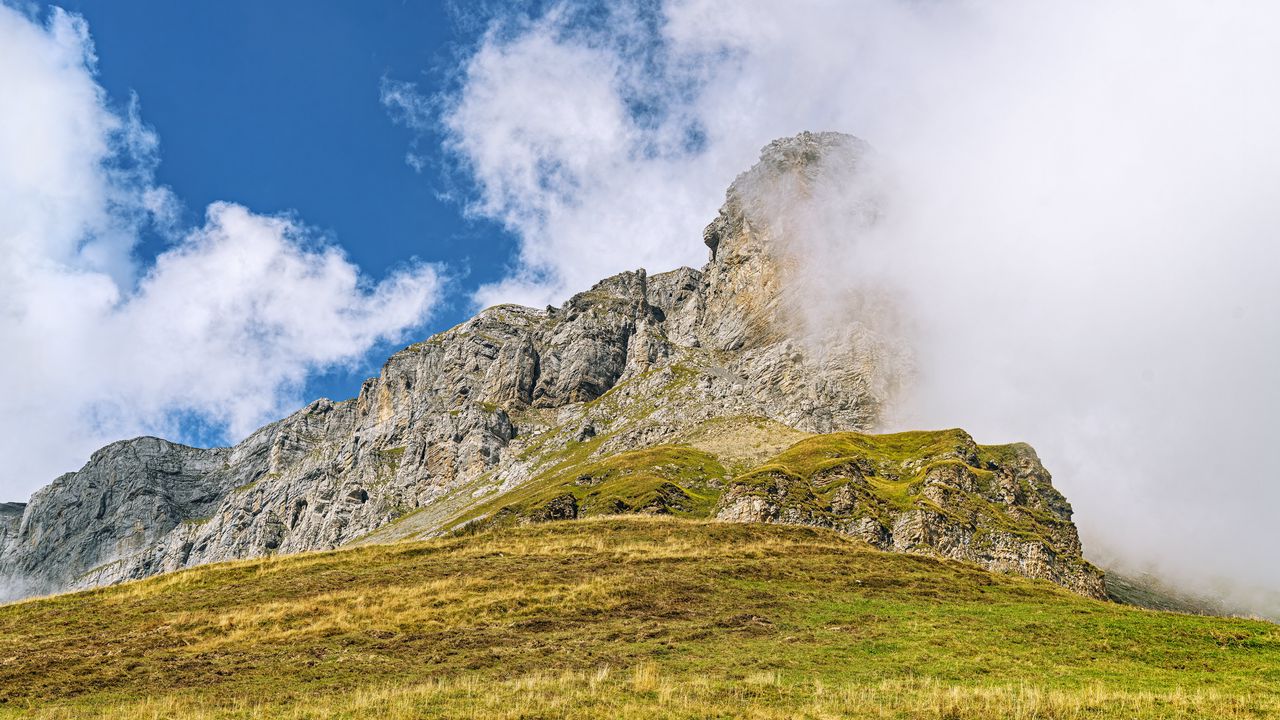 Wallpaper rock, cliff, fog, clouds, grass