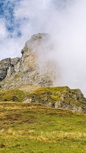 Preview wallpaper rock, cliff, fog, clouds, grass